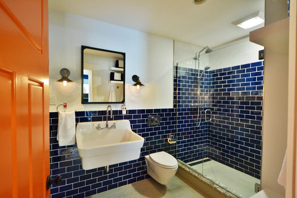 Basement renovation, pool bath, colored tile, trough sink, the wiese company
